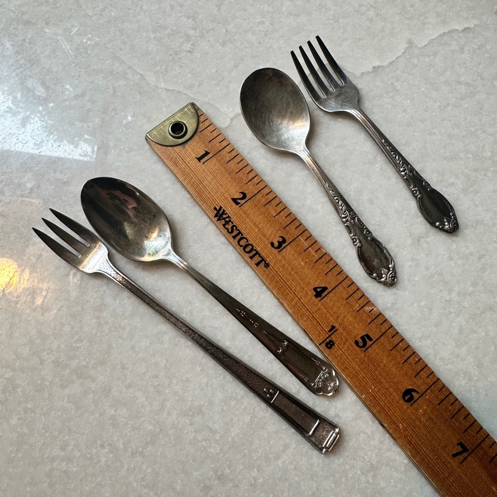 Small silverplate utensils.